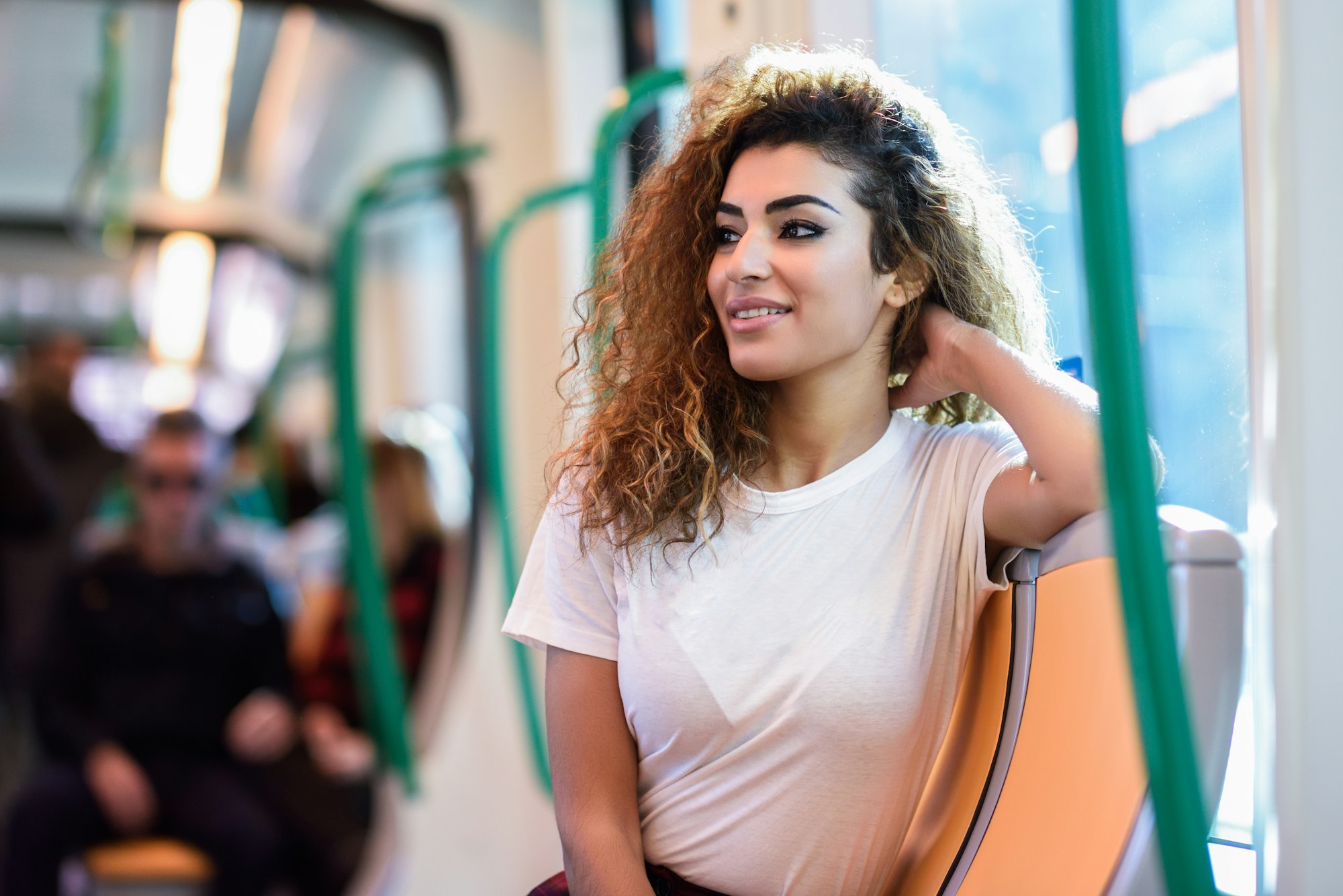 Arabic woman inside subway train. Arab girl in casual clothes